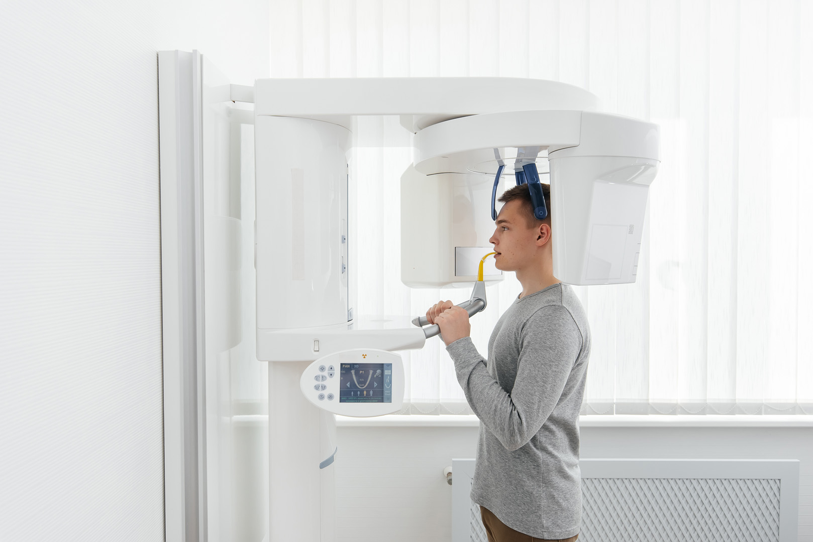 Patient receiving 3D CT dental scan at Periodontal Specialists of Hawaii