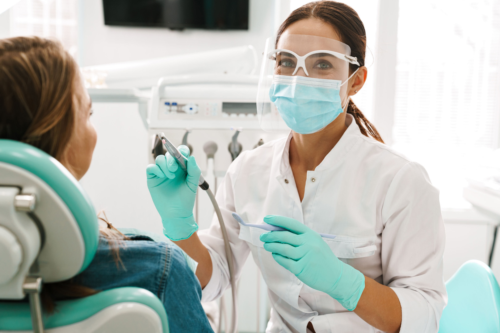 Dentist performing a comprehensive dental examination on a patient